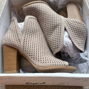 New in box.  Taupe peep toe booties by Qupid